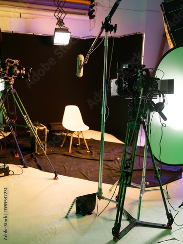 A sleek and modern filming studio awaits as cameras and lights are set for dynamic interviews and engaging podcasts. The vibrant space pulses with potential as creativity fills the air
