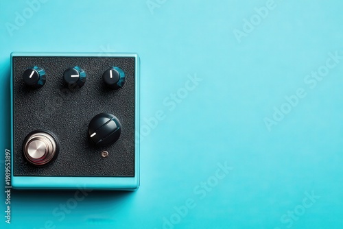 Stylish audio device control panel with knobs and buttons on vibrant blue background
