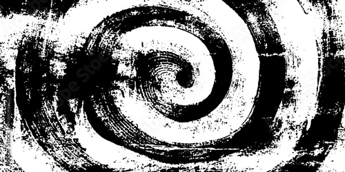 Spiral ink swirl forming circular pattern on paper surface