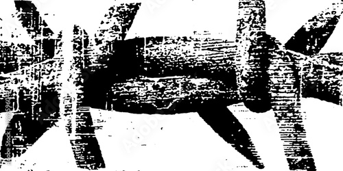 Barbed wire tangled across textured white surface