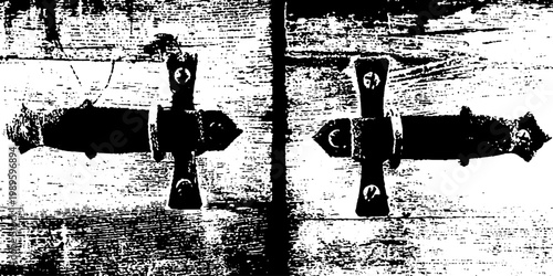 Rustic door hinges mounted on weathered wooden panel