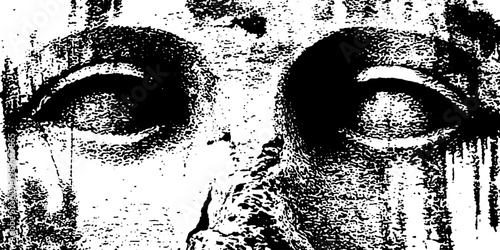 Ancient stone face showing weathered eyes in closeup