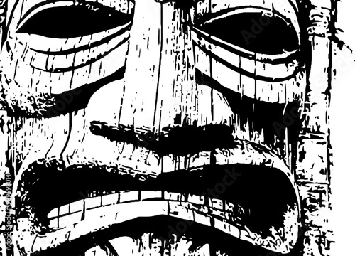 Full carved tiki face with pronounced grooves and grain closeup