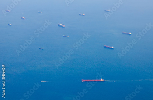 Tableau sur toile Multiple ships are seen on blue water
