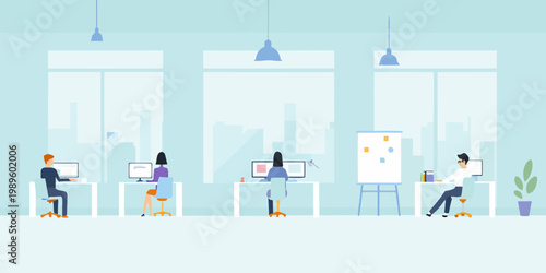 Modern open plan office space with employees working at their desks