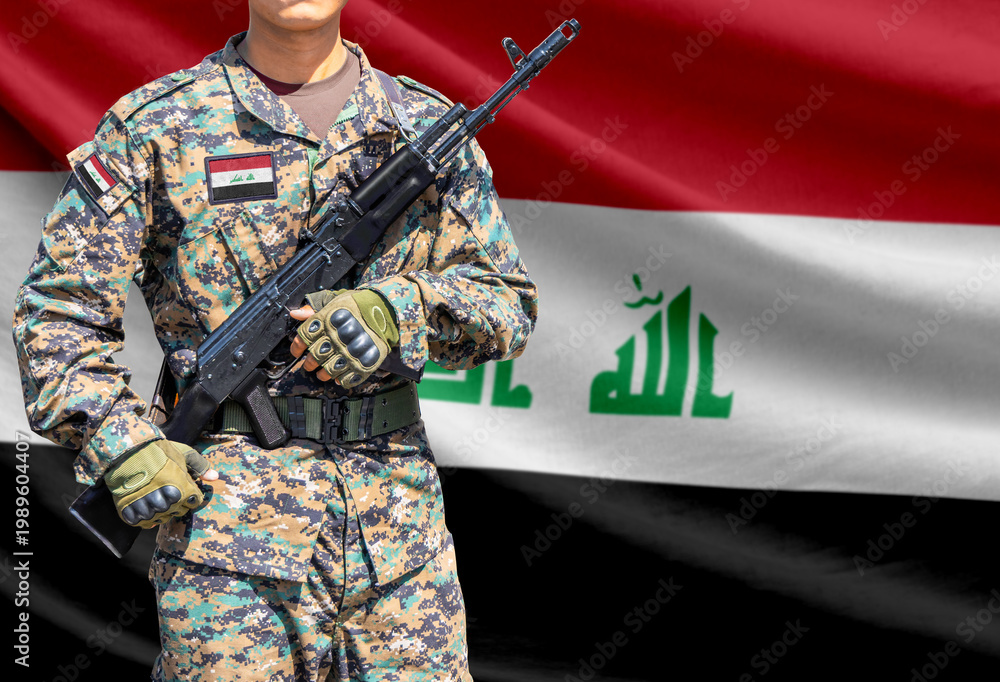 Obraz premium Iraq flag with soldier holding assault rifle