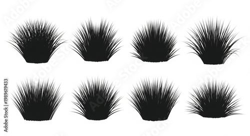 Eight black potted grass plants arranged in a grid formation studio shot