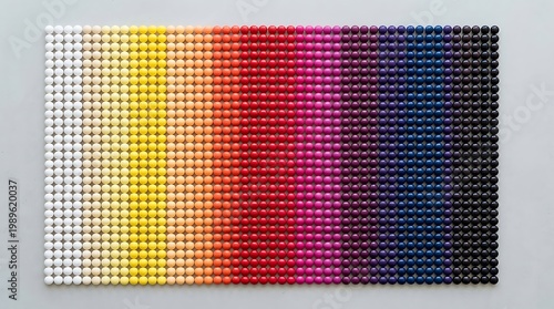 Colorful candy pieces arranged in a smooth gradient pattern from light to dark tones, creating a bright and playful visual background.	