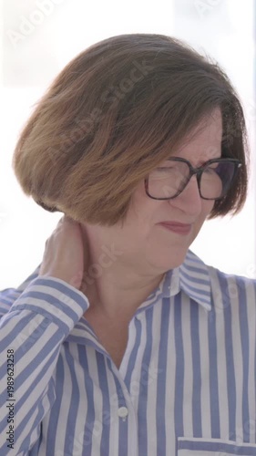 Portrait of Senior Woman having Neck Pain, Vertical Video