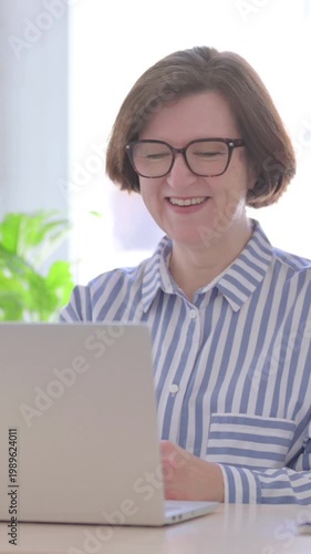 Online Video Call by Senior Woman in Office, Vertical Video