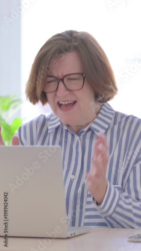Angry Senior Woman Screaming while Working on Laptop, Vertical Video