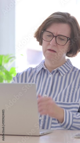 Senior Woman Reacting to Loss While using Laptop, Vertical Video