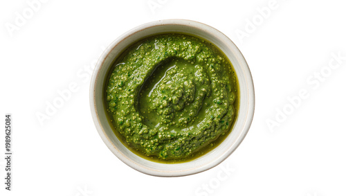 Foto Isolated bowl of fresh green pesto sauce for pasta and Italian cuisine overhead