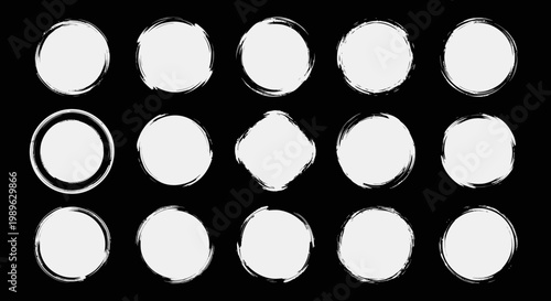 Set of Grunge White Circles with Rough Edges on Black Background