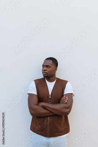 Confident african american man posing with crossed arms