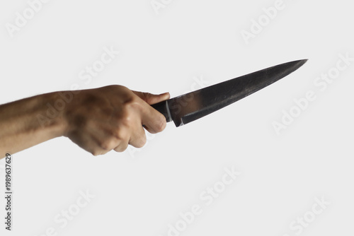 Person holding a sharp kitchen chef knife, isolated against a white background