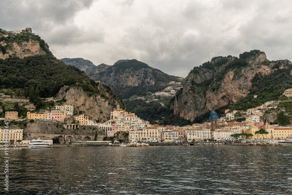 Fototapeta premium Scenic panoramic Amalfi vista in springtime under heavily overcast sky, Amalfi Coast, Campania, Southern Italy