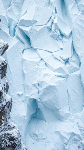 Exploring the Breathtaking Beauty of Frozen Landscapes: A Close-Up of a Glacier's Textured Surface Wrapped in Snow
