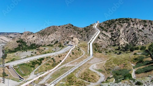 Wide Aerial View of the Los Angeles Aqueduct Cascades and Infrastructure in the Santa Clarita Foothills