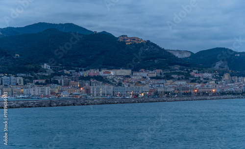 Scenic panoramic Salerno harbor vista at dusk, viewed from a boat, Campania, Southern Italy