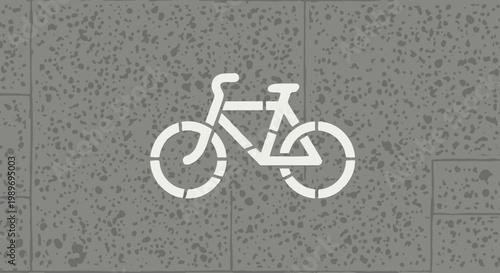White Bicycle Stencil Symbol on Textured Grey Concrete Surface