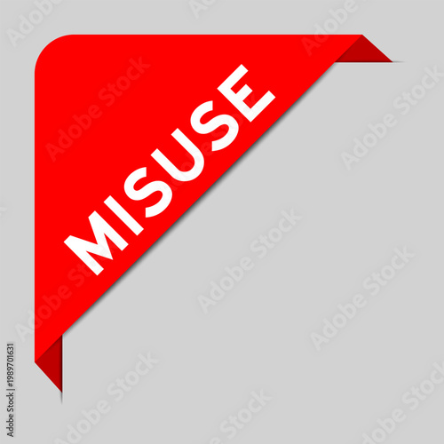 Red color of corner label banner with word misuse on gray background