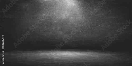 A dark and vintage black grunge background features a textured old concrete wall and dirty stone surface to create a moody blank backdrop for industrial interior design