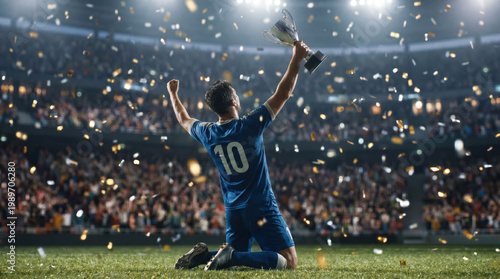 Soccer player celebrating victory holding trophy cup on stadium with falling confetti
