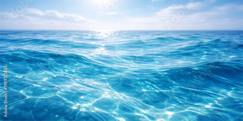 Clear blue sky with soft white clouds meets the horizon over an abstract turquoise ocean where sunlight reflects on the gentle surface of the summer sea waves