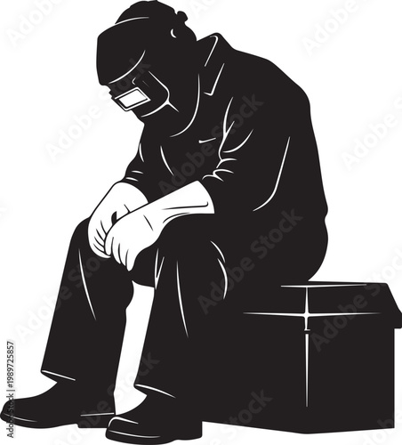 Sad welder sitting on toolbox with head bowed, depicting fatigue or contemplation of working class person in industrial setting.