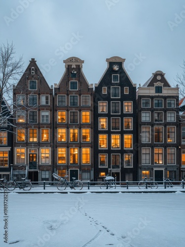 Snow-Covered Canal Houses with Warm Glowing Windows at Dusk