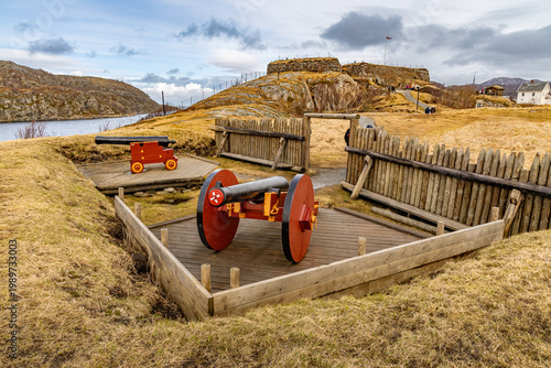Traditional red cannons on wooden platforms at the Nyholmen Skanse (Nyholmen Redoubt), a 19th-century coastal fortification overlooking the harbor in Bodø
