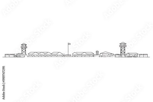 Exterior prison perimeter with multiple towers and low buildings