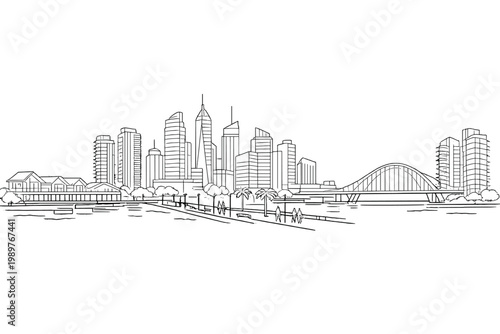 Urban skyline viewed across river with pedestrian promenade