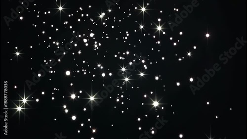 Sparkling white stars and sparkles on a black background