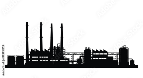 Industrial complex with smokestacks against a bright backdrop silhouette