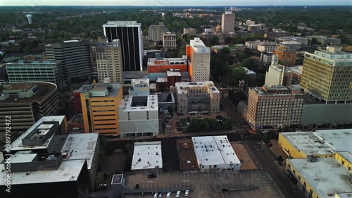 Business district with office buildings streets and urban blocks under cloudy evening sky Jackson Mississippi USA 