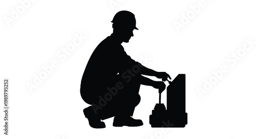 A technician repairs equipment focusing on a detailed task silhouette