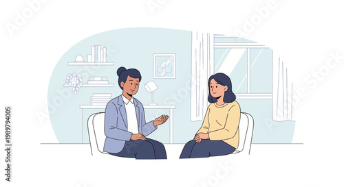 Two women sitting in chairs talking.