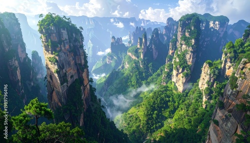 Stunning vista showcases unique rock formations and dense green vegetation under a partly cloudy sky. The valley reveals misty conditions