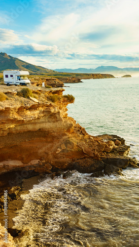 Camper vehicle capming on coast cliff, region of Mazarron in Murcia Spain.