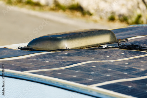 Dirty solar photovoltaic flexible panel on caravan roof