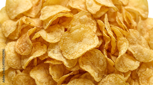 Close-up of a pile of golden potato chips snack food