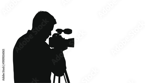 Photographer silhouette operates a professional camera on a tripod to capture high-quality digital media content in a creative studio setting that features generous copy space for text overlays.