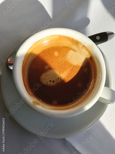 Coffee Morning Serenity. Morning Sunlight Bathes Peaceful Espresso Cup On Textured Linen Cloth
