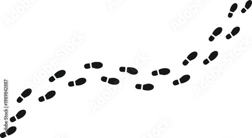 Footprints in sand a trail of steps leading across the surface