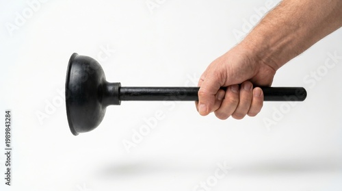 Hand holding a plunger, ready to resolve a plumbing issue