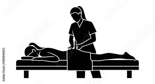 Physiotherapist performing massage on patients back.