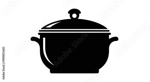 A large cooking pot with a lid sits on a stove for preparing dishes.