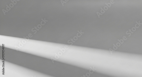 A minimalist abstract design featuring smooth gray and white curved lines